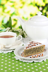 Delicious poppy seed cake with cup of tea
