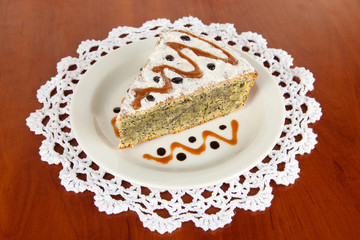Delicious poppy seed cake on table close-up