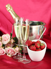 Romantic still life with champagne, strawberry and pink roses,
