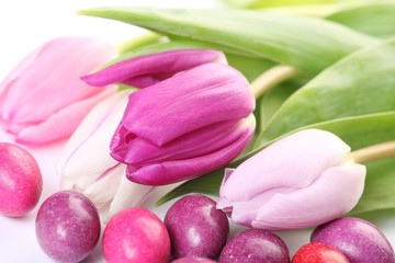 Close-up of candy eggs and tulips
