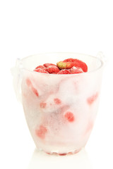 Frozen strawberries in bucket of ice isolated on white