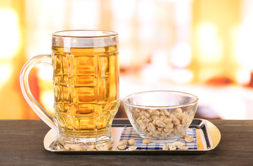 Beer in glass and nuts