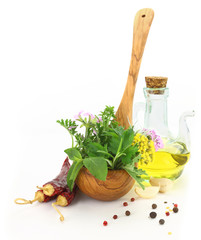 Fresh herbs and spices in wooden spoon