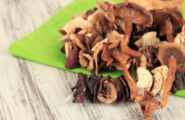Dried mushrooms on wooden background
