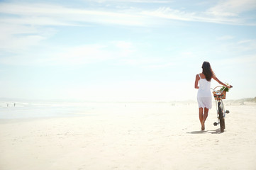 pushing bike on beach