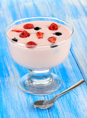 Delicious yogurt with fruit on table close-up