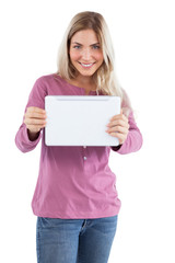 Fototapeta premium Smiling blonde woman holding tablet pc
