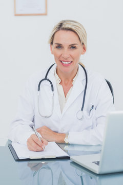 Portrait of an attractive doctor posing in her office