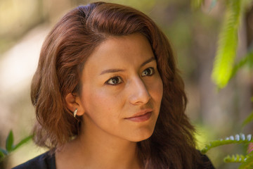 Fototapeta premium Young woman looking up