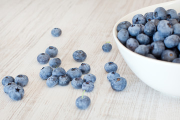 White bowl cup with fresh ripe blueberries