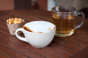 coffee cup on table and tea snack