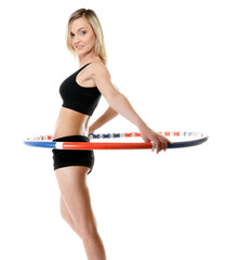 Fototapeta na wymiar young fitness woman with hula hoop isolated