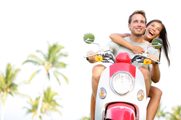 Free young couple on scooter on summer vacation