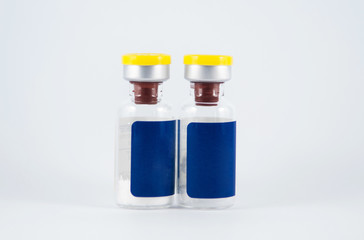 Yellow cap ampule on white background