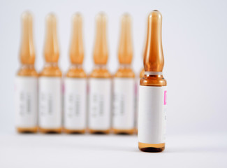 Brown injection ampule show medicine background