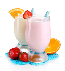 Delicious milk shakes with orange and strawberries isolated