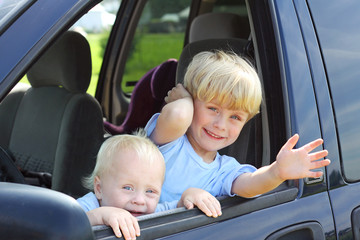 Children Smiling Out Van Window