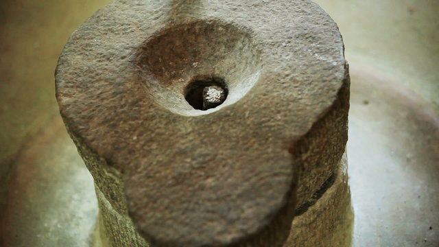 Old way of grinding rice for flour production