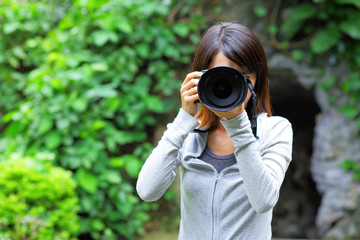 Asian woman taking photo