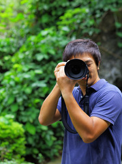 Asian man taking photo