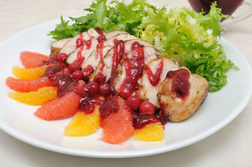 Sliced ​​baked fillet with cranberry sauce