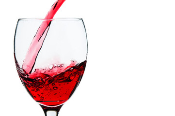 Pouring red wine into a glass