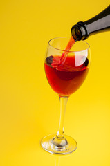 Pouring red wine into a glass