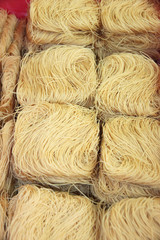 Drying Thai noodles.