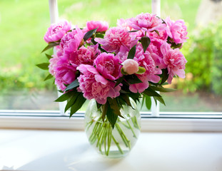 pink peonies on window sill © Diana Taliun