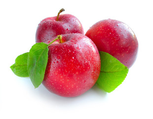 Ripe red apples on a white background