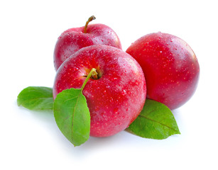 Ripe red apples on a white background
