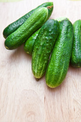 Green cucumber on the board