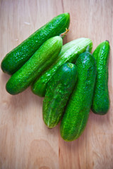 Green cucumber on the board