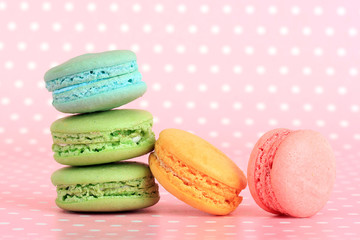 Gentle macaroons on pink background