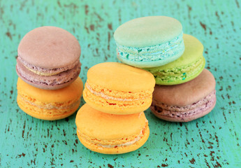 Macaroons on wooden table close-up