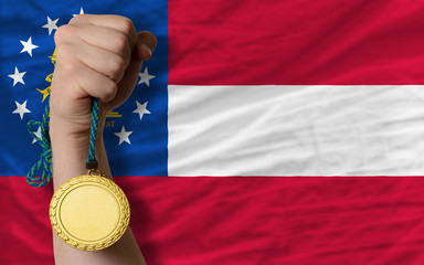 Gold medal for sport and  flag of american state of georgia