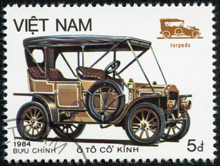 Fototapeta na wymiar stamp printed in the Vietnam, shows antique car