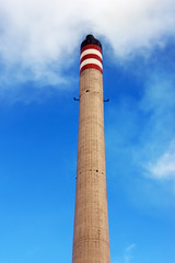 refinery smokestack generating smoke