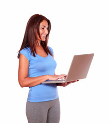 Fototapeta premium Sporty senior woman using her laptop computer