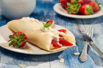 Strawberry pancakes with whipped cream