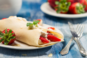Strawberry pancakes with whipped cream
