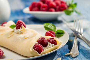 Closeup of pancakes with raspberry