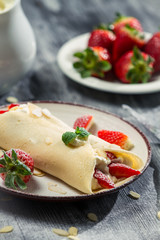Strawberry pancakes with whipped cream
