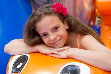Cute little girl plays in bouncing castle