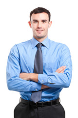 Smiling businessman with crossed arms