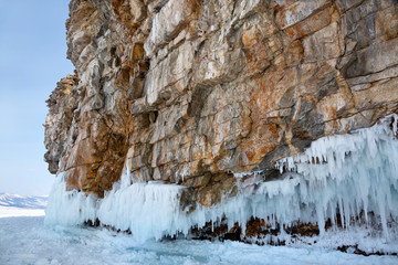 view of coast of Olkhon island and frozen baikal lake in winter