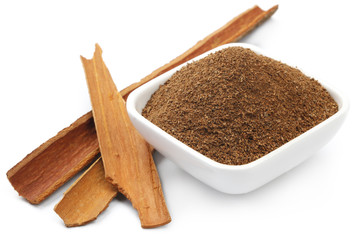 Cinnamon with Powder in a square Bowl