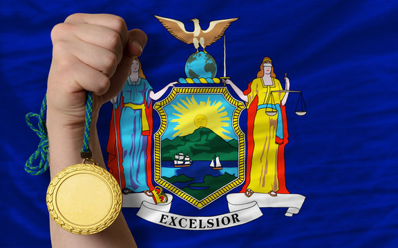 Gold medal for sport and flag of american state of new york