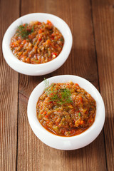 french aubergine eggplant caviar with oil  in white bowl on wood