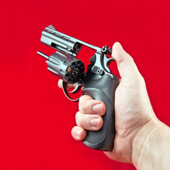 revolver in the man's hand